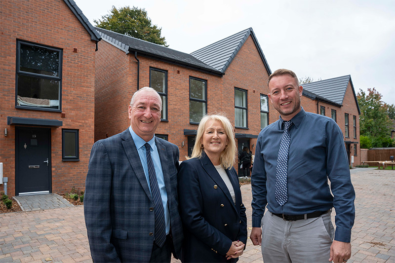 (L-R): Councillor Steve Evans, City of Wolverhampton Council Deputy Leader and Cabinet Member for City Housing & Assets, Councillor Linda Leach, City of Wolverhampton Council Cabinet Member for Adults, and Adam Walker, Morro Partnerships Construction Contracts Manager, outside the new council homes at Villiers Avenue