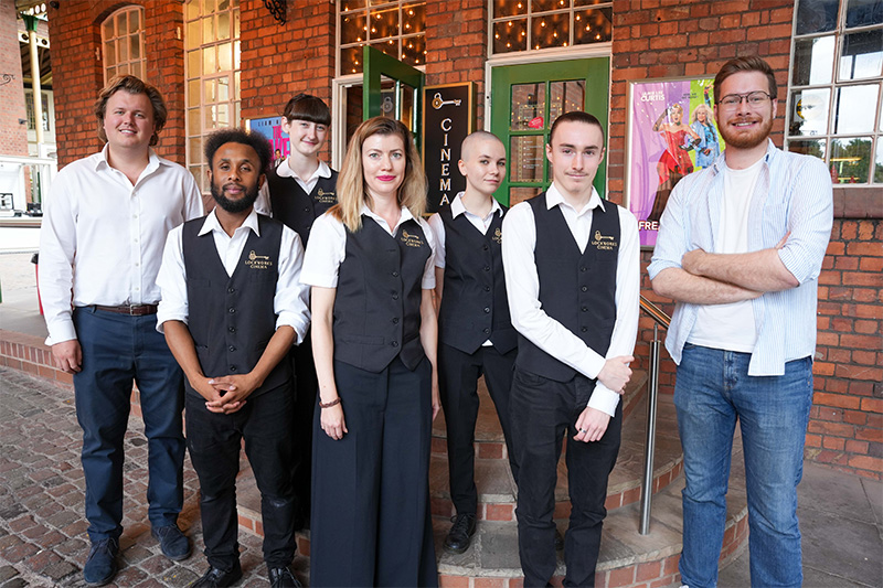 (L-R): James Jervis, Director at PDJ Management, with Lockworks Cinema employees supported by Wolves at Work - Deon Marcel Millen, Leah Yates, Maryna Nizhehorodtseva, Ffion Bessey and Jack Guy-Riches - and Cllr Chris Burden, Cabinet Member for City Development, Jobs and Skills